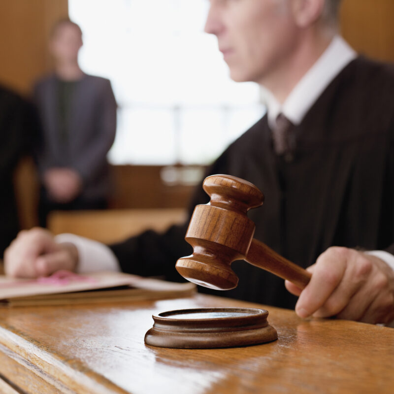 Closeup of judge hitting gavel